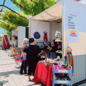 Market booth with shoppers 